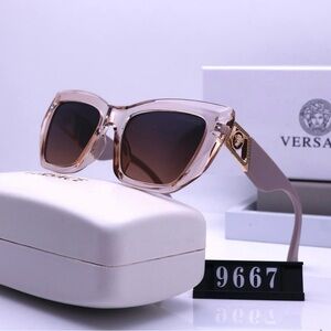 Versace Pink Cat-Eye Sunglasses with Gold Accents.